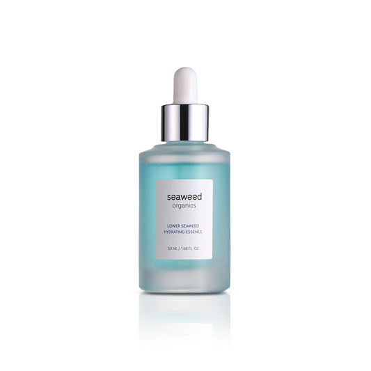 Glass pump bottle of Lower Seaweed Hydrating Essence on soft linen fabric