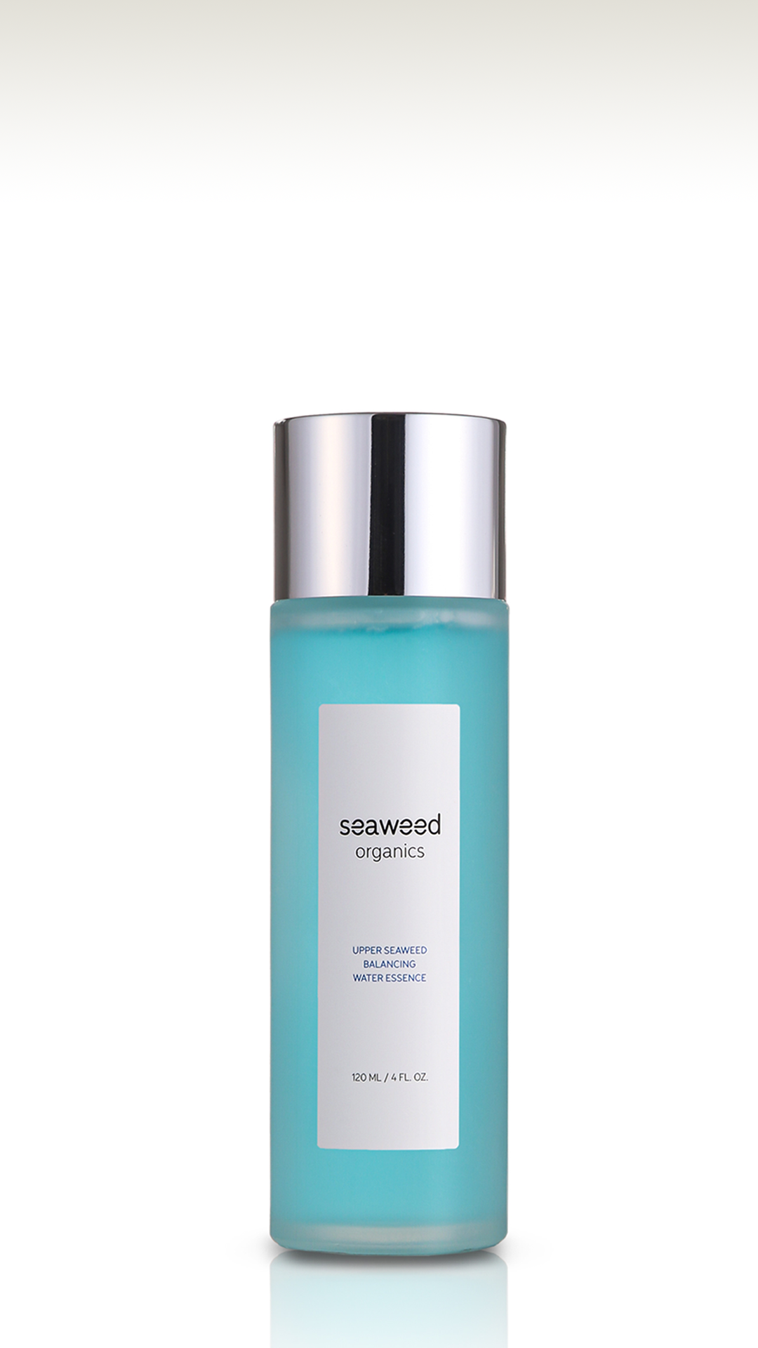 Balancing essence infused with Scottish seaweed, shown beside coastal stones