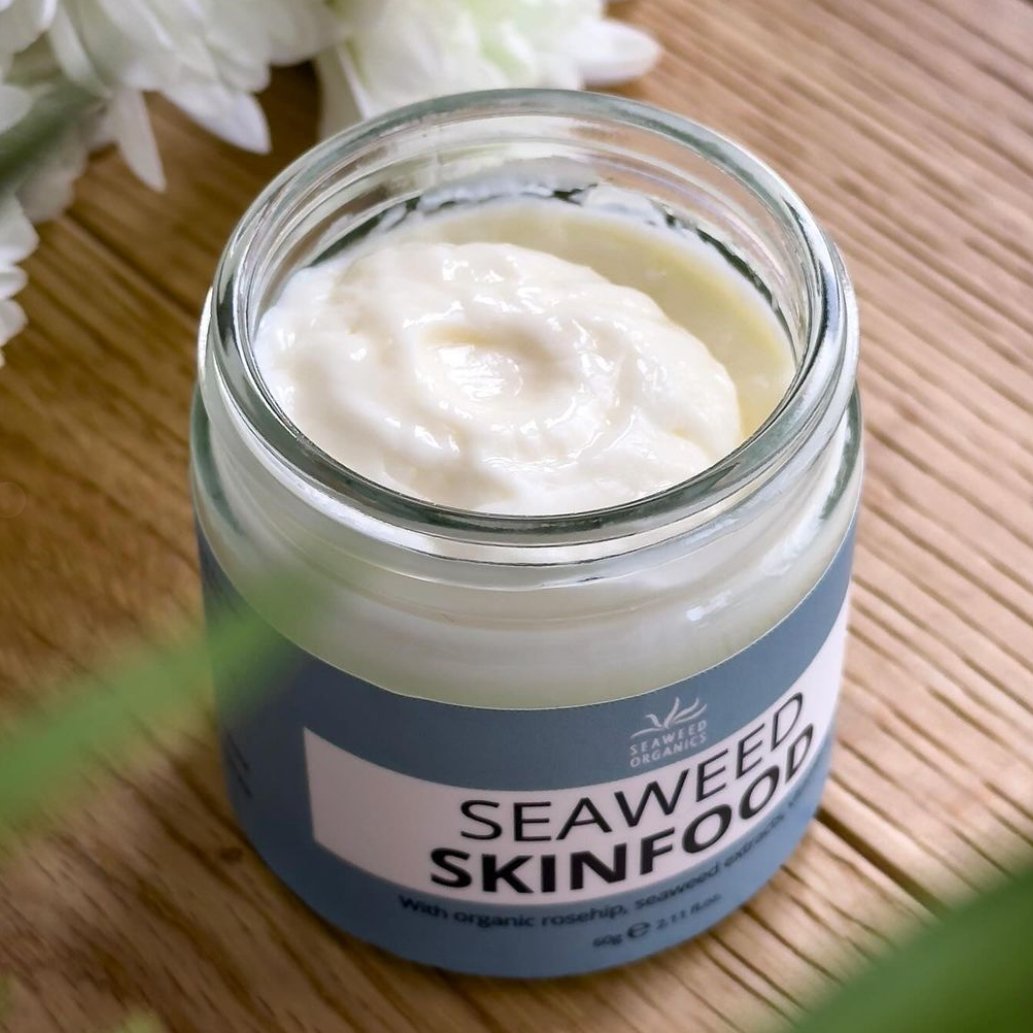 Close-up of jar containing rich seaweed-based facial cream for hydration